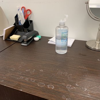 Stanton Optical - Sit here  to put in your trial pair of contacts--just shove our office stuff aside. The janitor doesn't get back here much. - Optometrists Near Me - Asheville, North Carolina