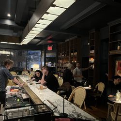 Middle facing the front with bar and more private seating behind