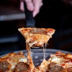 Cork N Crust - Four cheese meatball pizza on our traditional Neapolitan style pizza baked in our stone oven.