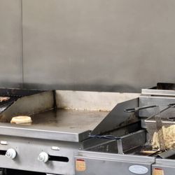 Big Sammy's Hot Dogs - Burgers and fries in the making.