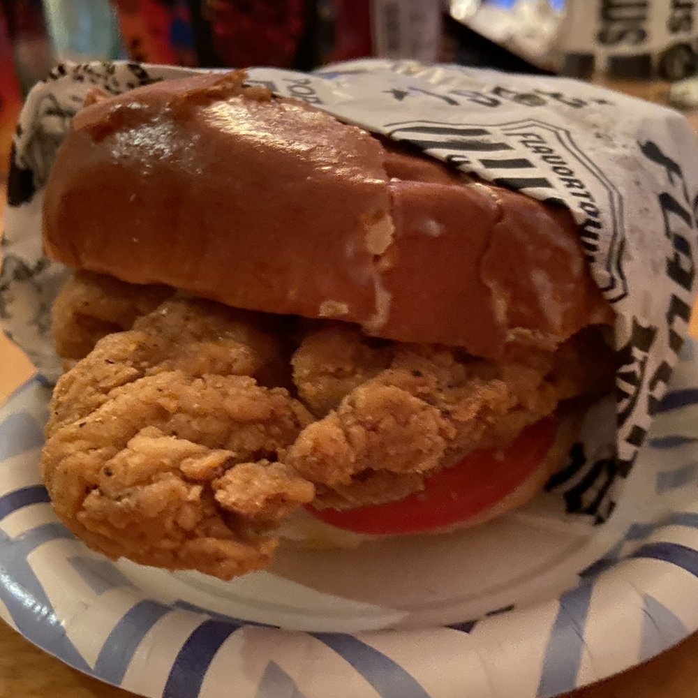 Guy Fieri's Flavortown Kitchen - The chicken sandwich - Food Delivery Services Near Me Guy Fieri's Flavortown Kitchen - The chicken sandwich - Food Delivery Services Near Me
