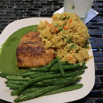 Choukouya Resto-Bar - Fried Salmon sitting on purée peas, vegetable rice and string beans. - African Near Me - Cleveland, Ohio
