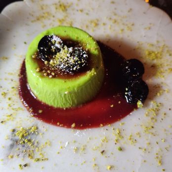Violette's Restaurant - The most amazing dessert! Pistachio panna cotta with cherry compote. - Italian Near Me - Woodbridge Township, New Jersey