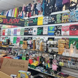 Graphic t-shirts lining the wall with other gifts.