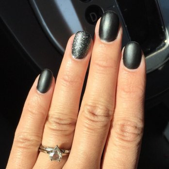 John's Creation - Matte Black with glitter in ring finger by Wendy. LOVE! - Nail Salons Near Me - San Carlos, California