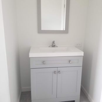 All Trade Construction - a bathroom with a sink and mirror - General Contractors Near Me All Trade Construction - a bathroom with a sink and mirror - General Contractors Near Me