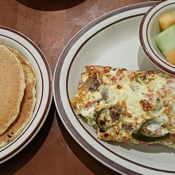 Townee Square Restaurant - The Townee Omelet with Gyros, Feta, Onions, Tomatoes and jalapeños* (*for a surcharge) with fruits and pancakes. - American Near Me - Libertyville, Illinois Townee Square Restaurant - The Townee Omelet with Gyros, Feta, Onions, Tomatoes and jalapeños* (*for a surcharge) with fruits and pancakes. - American Near Me - Libertyville, Illinois