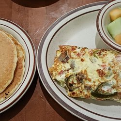 Townee Square Restaurant - The Townee Omelet with Gyros, Feta, Onions, Tomatoes and jalapeños* (*for a surcharge) with fruits and pancakes.