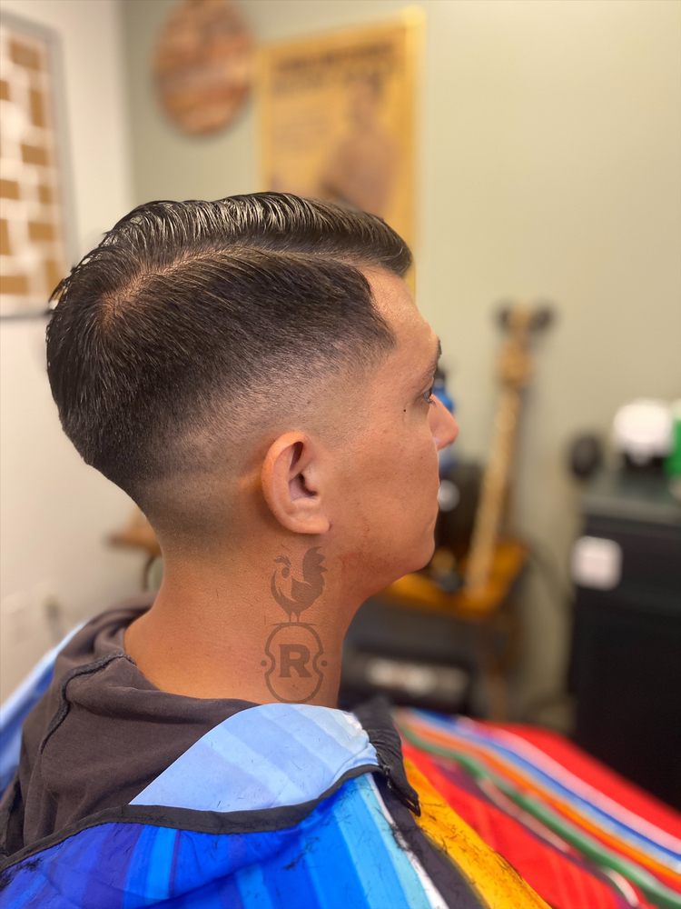 The Roost Barbershop Logo