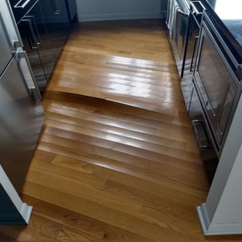 Rhema Construct - Kitchen floor water damage. - Flooring Near Me