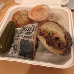 Brisket on pretzel bread - with side knish and pickle. Brisket on pretzel bread - with side knish and pickle.