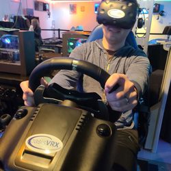 OasisVRX - Somehow my husband crashed his virtual car into a wall within 5 seconds of starting the race... and he calls ME the bad driver.