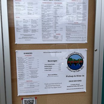 Buckland Pizza - menus on a bulletin board - Pizza Near Me - Shelburne Falls, Massachusetts