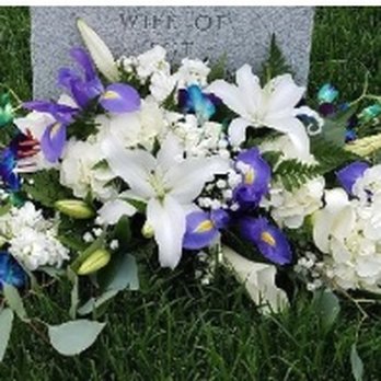 Hearts & Flowers - This is a long, flat centerpiece that we used for the ceremony and head table.  We took it to my mother's grave the next day (shown then). - Florists Near Me - Tinley Park, Illinois