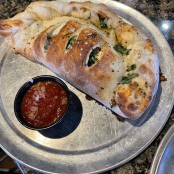 PaPPo's Pizzeria South - Awesome calzone filled with Italian sausage, sliced house made meatballs, and fresh spinach. - Pizza Near Me - Springfield, Missouri PaPPo's Pizzeria South - Awesome calzone filled with Italian sausage, sliced house made meatballs, and fresh spinach. - Pizza Near Me - Springfield, Missouri