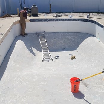 Picture Perfect Pools - Ryan applying new tiles. - Pool & Hot Tub Service Near Me Picture Perfect Pools - Ryan applying new tiles. - Pool & Hot Tub Service Near Me