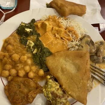 Thali of India - Assorted plate (Bhature, Chicken Makhani, Chana Masala, pakora, Palak Paneer) - Indian Near Me - Rochester, New York Thali of India - Assorted plate (Bhature, Chicken Makhani, Chana Masala, pakora, Palak Paneer) - Indian Near Me - Rochester, New York