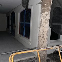 30A Escapes - Patio under construction with door boarded up.