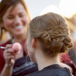 A Private Salon - Marisol perfecting make-up on a model for hair and make-up ad for bridal services.