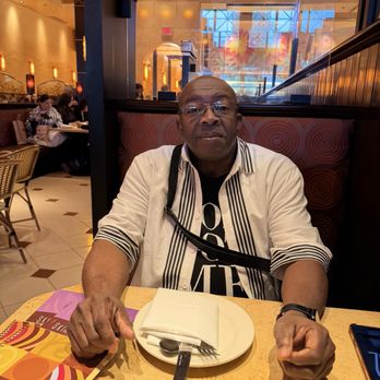 The Cheesecake Factory - Eugene sitting at the table - New American Near Me - Providence, Rhode Island The Cheesecake Factory - Eugene sitting at the table - New American Near Me - Providence, Rhode Island