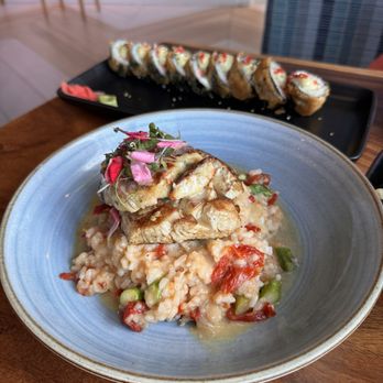 Hudson On The River - Crab and Lobster cake topped on Mahi with sun dried tomato and asparagus risotto. - New American Near Me - Stuart, Florida Hudson On The River - Crab and Lobster cake topped on Mahi with sun dried tomato and asparagus risotto. - New American Near Me - Stuart, Florida