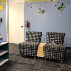 LA County Library - Comfy couches for adults to sit as their children go play or read books.