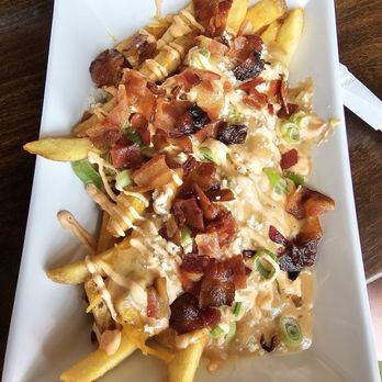 Liquid Sunshine Taproom - Food - Loaded Fries / Actually had a good sriracha spicy snap to it. - Sports Bars Near Me - La Vista, Nebraska Liquid Sunshine Taproom - Food - Loaded Fries / Actually had a good sriracha spicy snap to it. - Sports Bars Near Me - La Vista, Nebraska