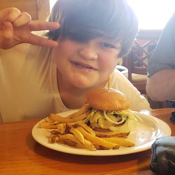 Mintos Bar & Grill - The sandwich in the photo is the El Diablo burger with a side of fries. - Bars Near Me - Donalsonville, Georgia