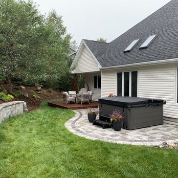 Sun and Shade Landscaping - Backyard oasis with new patio, Hottub Pad, Retaining Wall, and composite decking; Lighting added for beautiful nightime effect - Landscaping Near Me - Quispamsis, New Brunswick Sun and Shade Landscaping - Backyard oasis with new patio, Hottub Pad, Retaining Wall, and composite decking; Lighting added for beautiful nightime effect - Landscaping Near Me - Quispamsis, New Brunswick