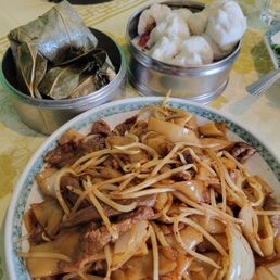 From top, left to right: Traditional sticky rice, char sui bao (BBQ pork steamed buns), beef chow fun From top, left to right: Traditional sticky rice, char sui bao (BBQ pork steamed buns), beef chow fun