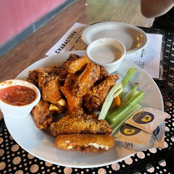 Characters - a plate of fried wings with dipping sauce and celery - Bars Near Me - Sloatsburg, New York Characters - a plate of fried wings with dipping sauce and celery - Bars Near Me - Sloatsburg, New York