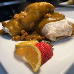 Breakfast Burrito smothered with Green Chili