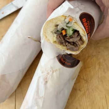 Paris Banh Mi- Davie - Our 2 sandwiches perfectly rolled up and ready to go: B2. GRILLED PORK / BANH MI THT NNG - Sandwiches Near Me - Davie, Florida Paris Banh Mi- Davie - Our 2 sandwiches perfectly rolled up and ready to go: B2. GRILLED PORK / BANH MI THT NNG - Sandwiches Near Me - Davie, Florida