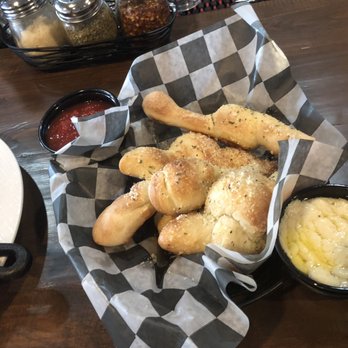 The Brick-Wood Fired Eats - Garlic Knots - marinara sauce & cheese sauce - Pizza Near Me - Dover, Delaware The Brick-Wood Fired Eats - Garlic Knots - marinara sauce & cheese sauce - Pizza Near Me - Dover, Delaware