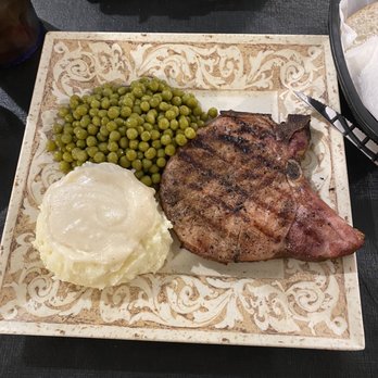 Carriage Inn - Smoked pork chop, peas, mashed potatoes with milk gravy. I also had their sweet corn nuggets and sweet tea. - American Near Me - Haubstadt, Indiana