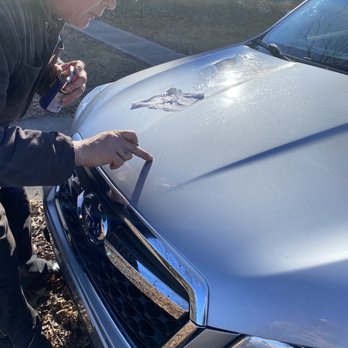 Rockstar Indy - Him cleaning the epoxy off my hood. - Windshield Installation & Repair Near Me - Indianapolis, Indiana
