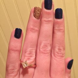 Gorgeous navy blue and gold accent nail. Completely gel. I got this mani over a month ago and it's still going strong! I love it!!!!!
