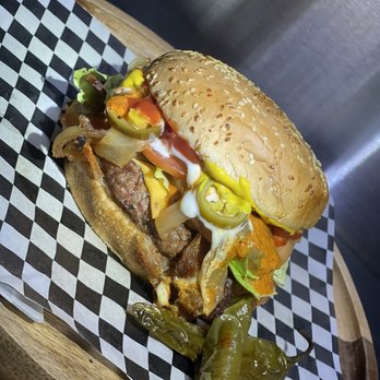 El Santo Dogo - a close up of a sandwich - Hot Dogs Near Me - Modesto, California El Santo Dogo - a close up of a sandwich - Hot Dogs Near Me - Modesto, California