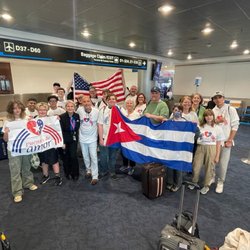 Cuba Travel Services - Miami Internacional Airport. Cuba Travel Services enjoying time with Carlos Lazo Líder Puentes de Amor..
