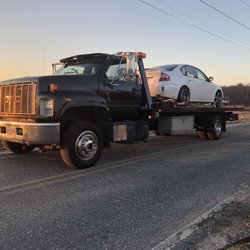 Johnny's Auto Body & Sales - Tow truck
