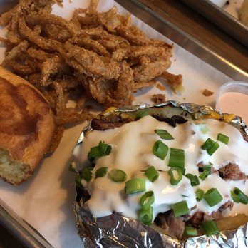 Badlands BBQ - Badlands baked potato with beef brisket with side of onion straws, chipotle sauce and cornbread . So good!! - Barbeque Near Me - Norco, California