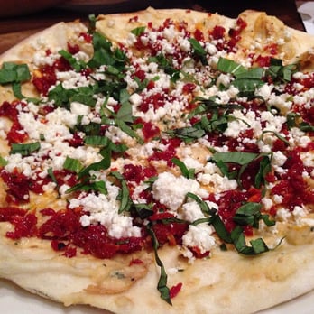 Tomatina - Flat bread with hummus, sundried tomatoes, basil, and feta cheese - Italian Near Me - Alameda, California Tomatina - Flat bread with hummus, sundried tomatoes, basil, and feta cheese - Italian Near Me - Alameda, California