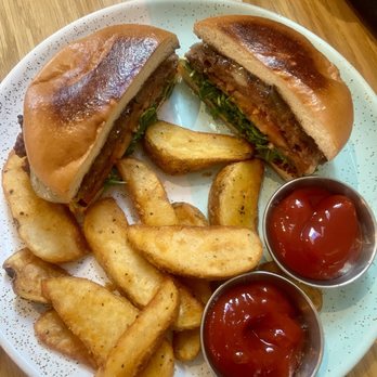 Bluestone Lane - Impossible Burger with potato wedges. - Coffee & Tea Near Me - Orange, California Bluestone Lane - Impossible Burger with potato wedges. - Coffee & Tea Near Me - Orange, California