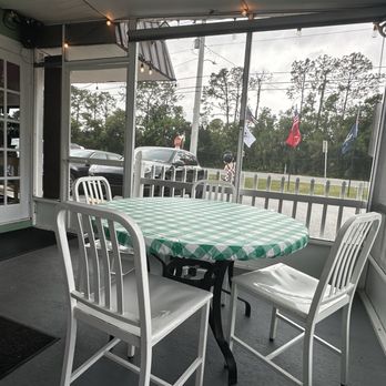 Southside Grille - Covered outdoor screened in dining - New American Near Me - Bunnell Florida, Florida
