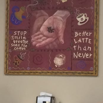 Main Street Donuts - a painting of a hand holding a coffee cup - Donuts Near Me - Ottumwa, Iowa Main Street Donuts - a painting of a hand holding a coffee cup - Donuts Near Me - Ottumwa, Iowa
