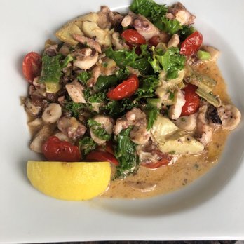 Bon Appetit - Mediterranean Octopus with Artichokes, Pancetta, Tomatoes, Roasted Garlic and Kale. - New American Near Me - Dunedin, Florida