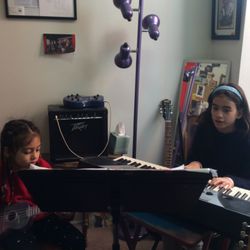 Guitar, Ukulele and Voice Lessons with Sarah Flint - Sibling harmony.