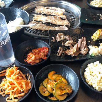 Yummy's BBQ and Sushi - There is Pork Belly on the grill, Kimchi, Oi Kimchi, Mu Chae ad Mac Salad pictured here. There's also some half eaten Beef Bulgogi! :) - Sushi Bars Near Me - Orem, Utah Yummy's BBQ and Sushi - There is Pork Belly on the grill, Kimchi, Oi Kimchi, Mu Chae ad Mac Salad pictured here. There's also some half eaten Beef Bulgogi! :) - Sushi Bars Near Me - Orem, Utah