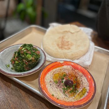 Mazra - Sides of hummus and Tabbouleh Salad that come with the lamb shank - Middle Eastern Near Me - San Bruno, California Mazra - Sides of hummus and Tabbouleh Salad that come with the lamb shank - Middle Eastern Near Me - San Bruno, California