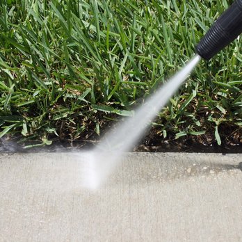 Ramirez Landscape Maintenance - a person using a hose to clean a lawn - Lawn Services Near Me